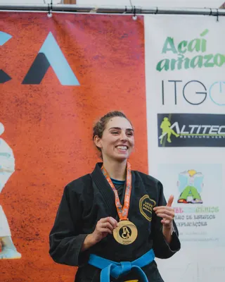 An Under Pressure athlete with her medal