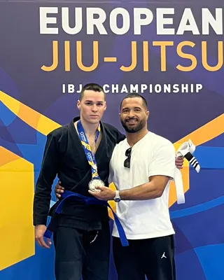 An Under Pressure athlete on the podium of the 2025 IBJJF European Championship