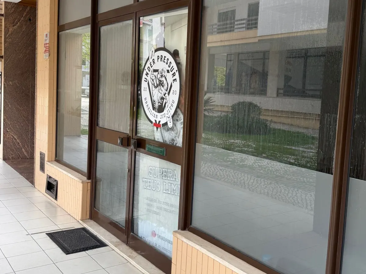 The Under Pressure door, with the logo on the glass